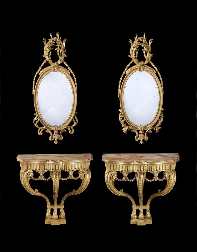 A PAIR OF GEORGE III GILTWOOD CONSOLE TABLES EN SUITE WITH A PAIR OF GILTWOOD OVAL MIRRORS | MasterArt